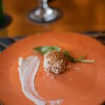 a plate with a dessert on it on a table